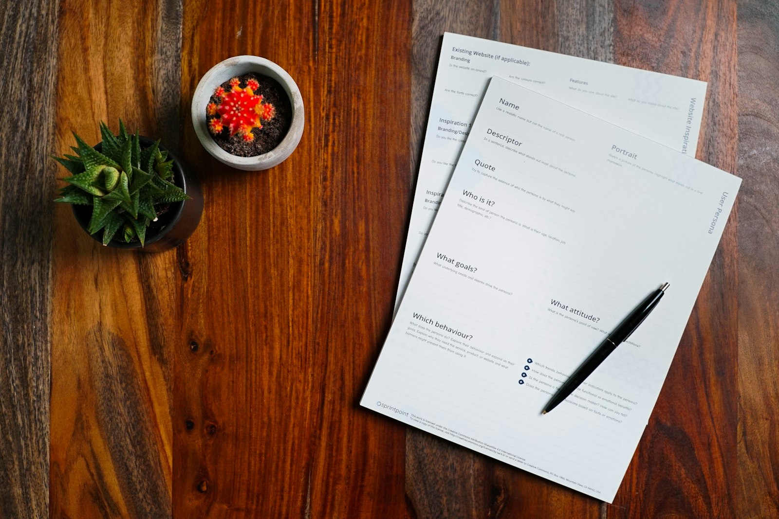 Invoice documents and pen on a wooden desk