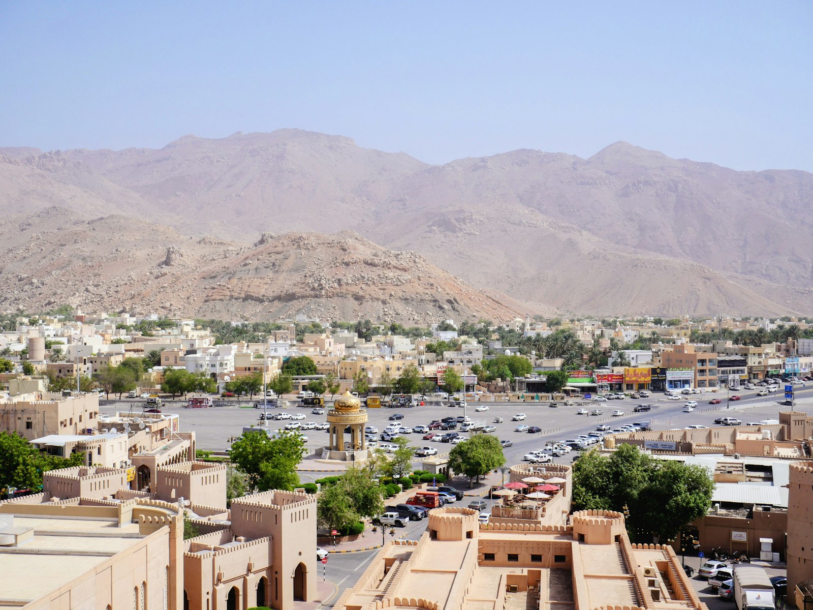 Omani town framed by desert mountains