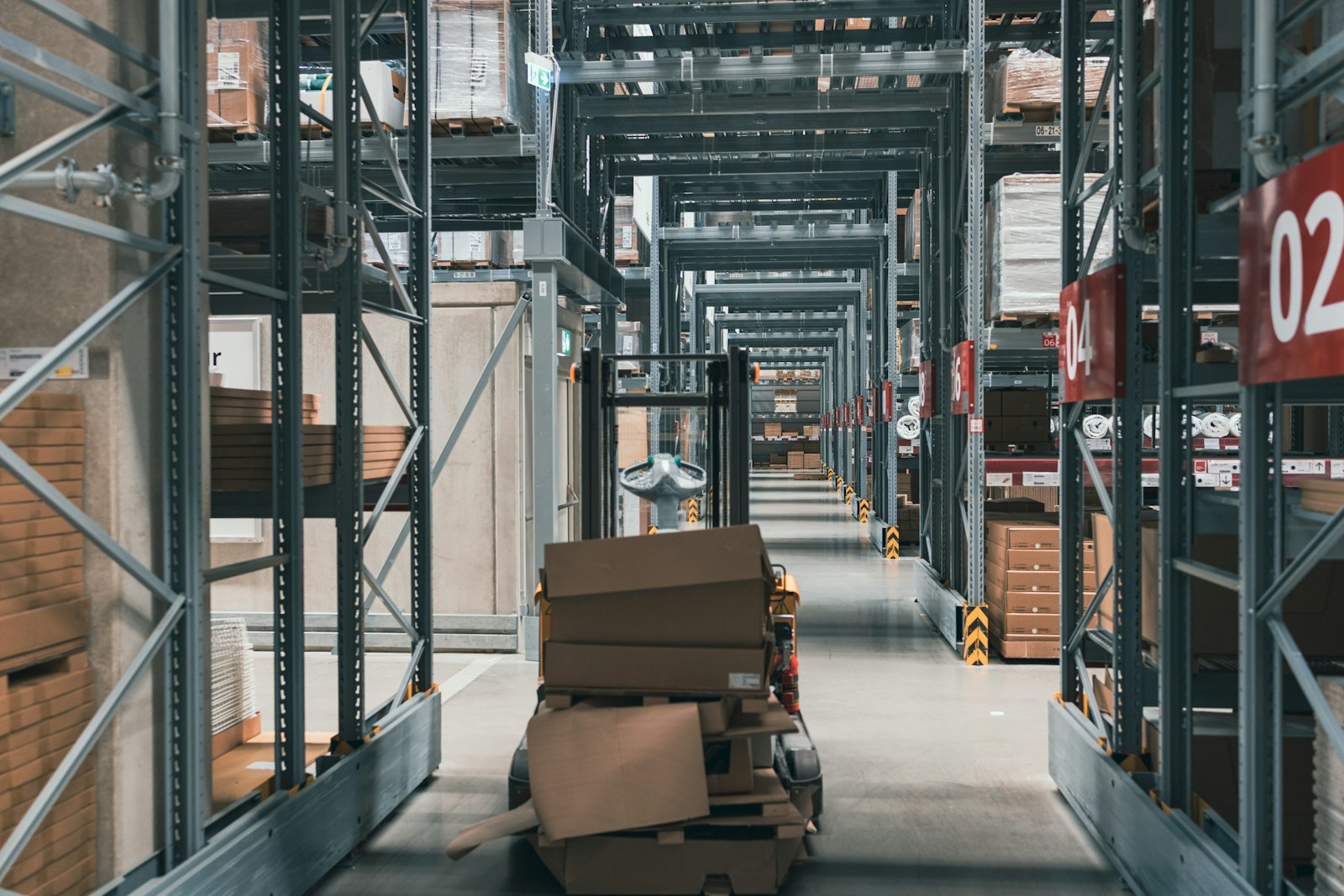 Warehouse aisle stacked with neatly organised cartons